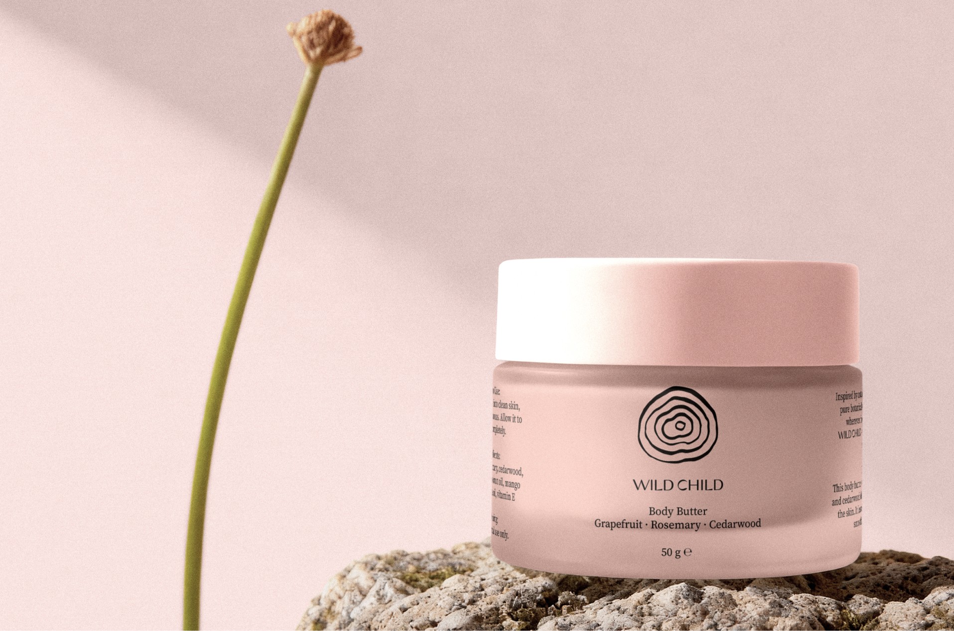 Body Butter im Wild-Child-Design auf einem Stein